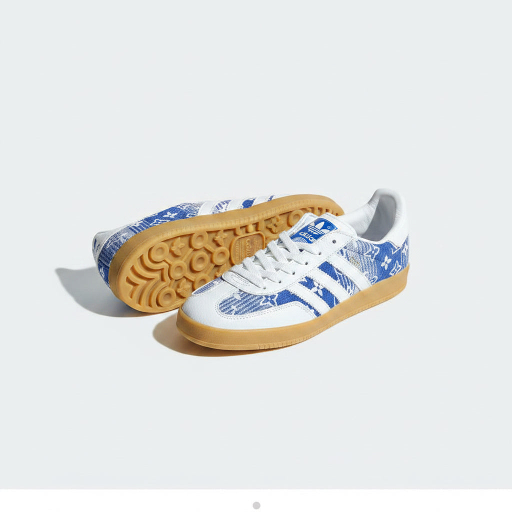 Adidas sports shoes in white and blue design with gum sole, showcasing ergonomic support for athletes.