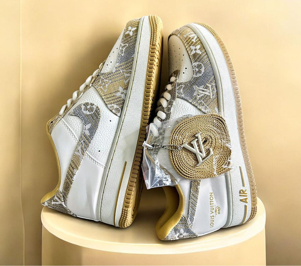 Nike ergonomic training shoes with decorative Louis Vuitton patterns, offering a stylish fusion of sportswear and luxury.